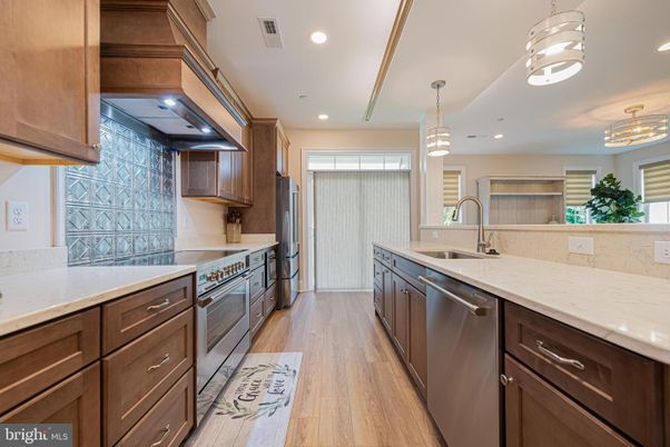 Chandelier, Interior, Kitchen, Pendant Lights, Recessed Lighting, Stainless Steel Appliances, Wood Texture Flooring