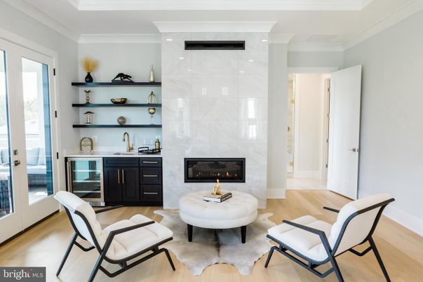 Fireplace, Interior, Marble Walls, Recessed Lighting, Wood Texture Flooring