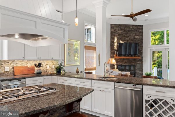 Fireplace, Interior, Kitchen, Pendant Lights, Recessed Lighting, Stainless Steel Appliances, Stone Walls