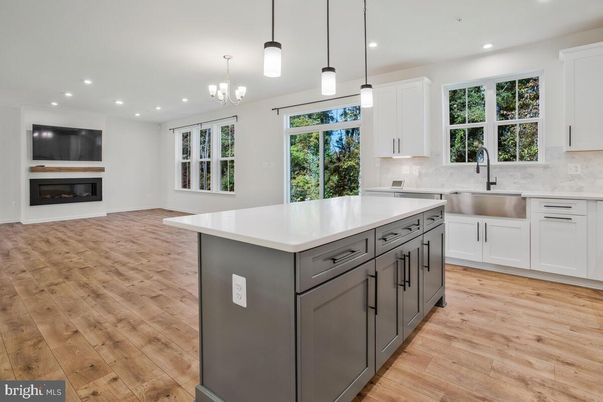 Chandelier, Fireplace, Interior, Kitchen, Pendant Lights, Recessed Lighting, Wood Texture Flooring