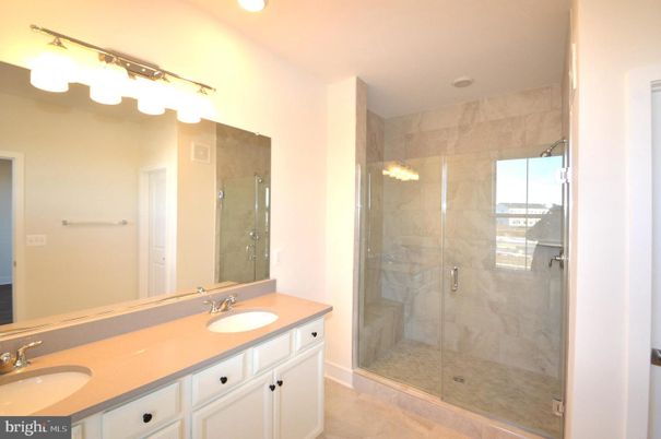 Bathroom, Dual Sink Vanities, Glass Shower, Interior, Marble Walls, Recessed Lighting