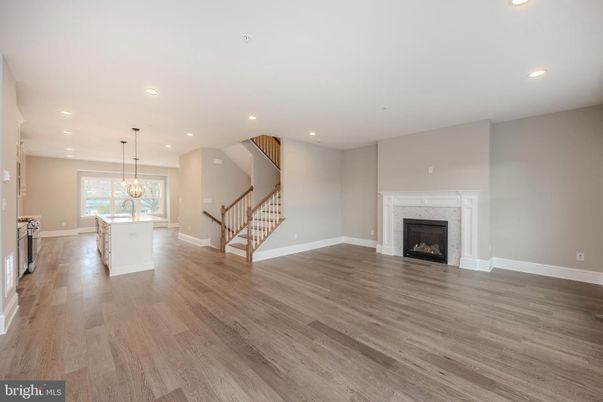 Chandelier, Dining room, Empty room, Fireplace, Interior, Kitchen, Pendant Lights, Recessed Lighting, Wood Texture Flooring
