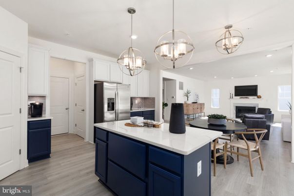 Chandelier, Dining room, Fireplace, Interior, Kitchen, Living room, Pendant Lights, Recessed Lighting, Stainless Steel Appliances, Wood Texture Flooring
