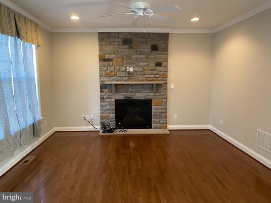 Empty room, Fireplace, Interior, Recessed Lighting, Stone Walls, Wood Texture Flooring