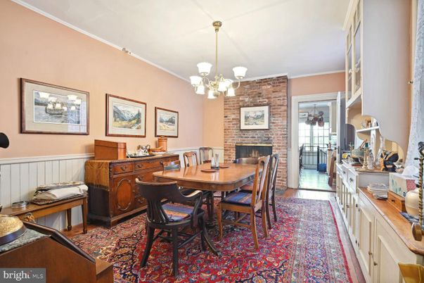 Chandelier, Dining room, Fireplace, Interior, Stone Walls, Wood Texture Flooring