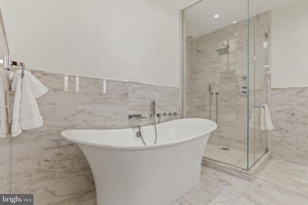 Bathroom, Free Standing Baths, Glass Shower, Interior, Marble Walls, Recessed Lighting