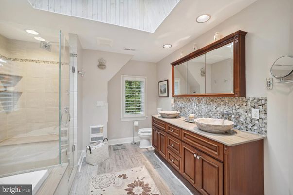 Bathroom, Dual Sink Vanities, Glass Shower, Interior, Recessed Lighting, Wood Texture Flooring