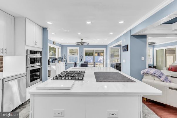 Dining room, Interior, Kitchen, Living room, Recessed Lighting, Stainless Steel Appliances, Wood Texture Flooring