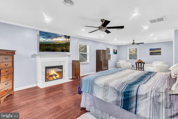 Bedroom, Fireplace, Interior, Recessed Lighting, Wood Texture Flooring