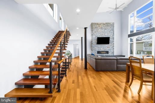 Dining room, Fireplace, Interior, Recessed Lighting, Stone Walls, Wood Texture Flooring