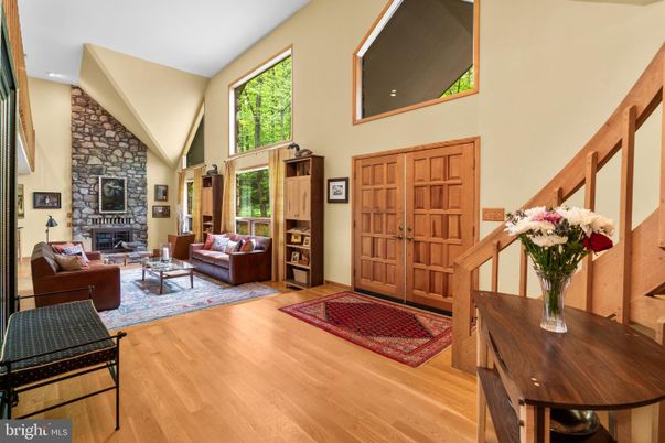 Fireplace, Interior, Living room, Recessed Lighting, Stone Walls, Wood Texture Flooring