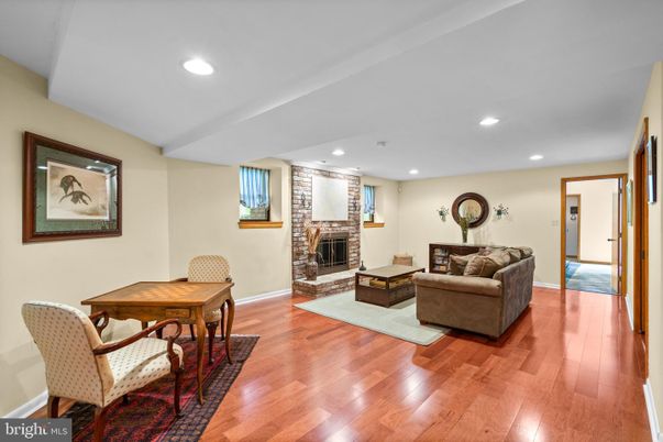 Dining room, Fireplace, Interior, Living room, Recessed Lighting, Wood Texture Flooring