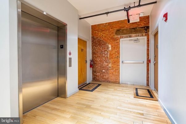 Elevator, Interior, Stone Walls, Wood Texture Flooring