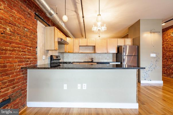 Interior, Kitchen, Pendant Lights, Stainless Steel Appliances, Stone Walls, Wood Texture Flooring