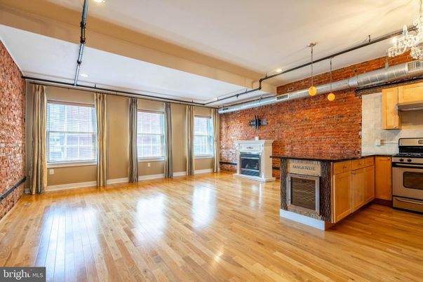 Fireplace, Interior, Kitchen, Recessed Lighting, Stainless Steel Appliances, Stone Walls, Wood Texture Flooring