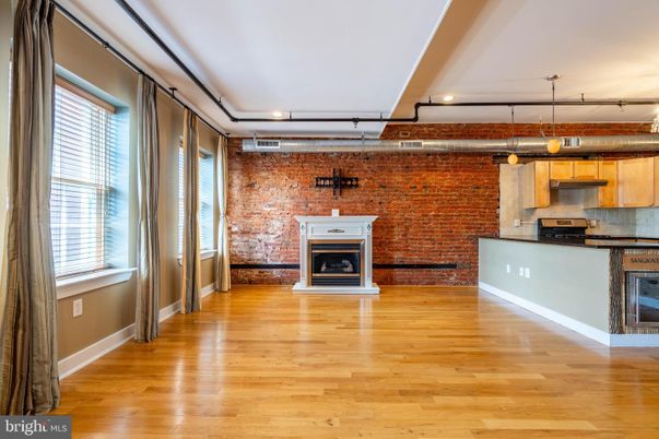 Fireplace, Interior, Kitchen, Pendant Lights, Recessed Lighting, Stone Walls, Wood Texture Flooring
