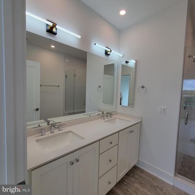 Bathroom, Dual Sink Vanities, Glass Shower, Interior, Recessed Lighting, Wood Texture Flooring