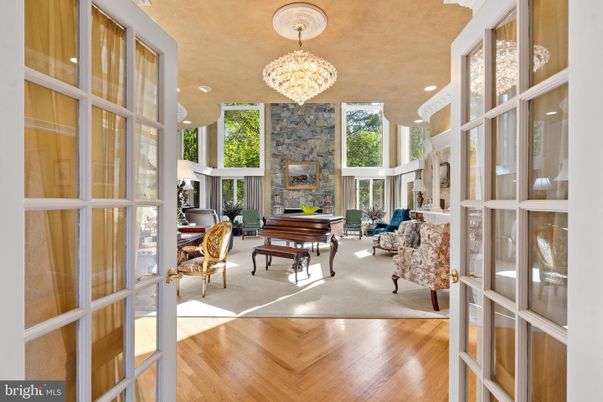 Chandelier, Interior, Living room, Piano, Recessed Lighting, Stone Walls, Wood Texture Flooring