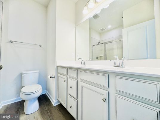 Bathroom, Dual Sink Vanities, Interior, Recessed Lighting, Wood Texture Flooring