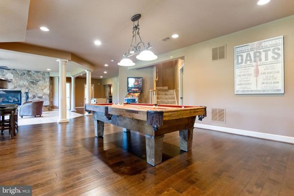 Billiard Table, Fireplace, Game Room, Interior, Pendant Lights, Recessed Lighting, Stone Walls, Wood Texture Flooring