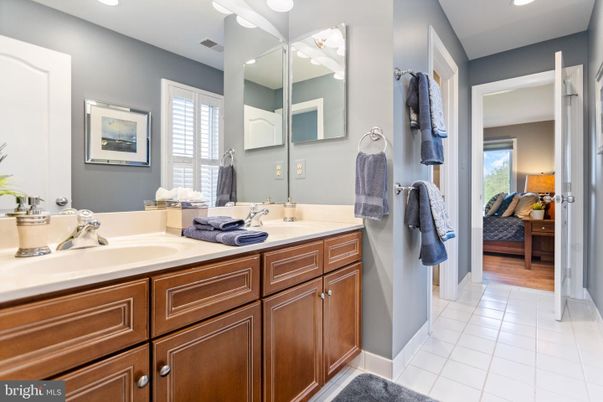 Bathroom, Dual Sink Vanities, Interior, Recessed Lighting, Wood Texture Flooring