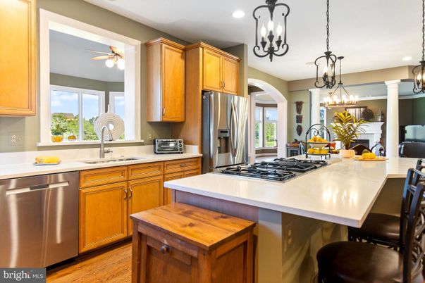 Chandelier, Interior, Kitchen, Pendant Lights, Recessed Lighting, Stainless Steel Appliances, Wood Texture Flooring