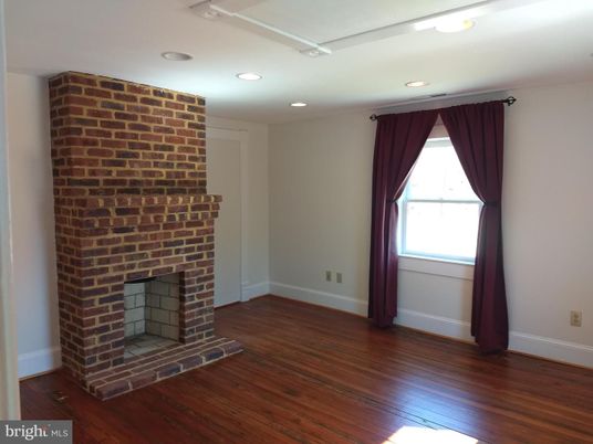 Empty room, Fireplace, Interior, Recessed Lighting, Stone Walls, Wood Texture Flooring