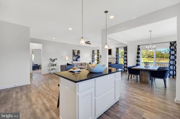 Dining room, Fireplace, Interior, Living room, Pendant Lights, Recessed Lighting, Wood Texture Flooring