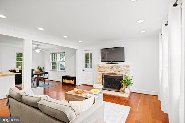 Dining room, Fireplace, Interior, Living room, Recessed Lighting, Wood Texture Flooring