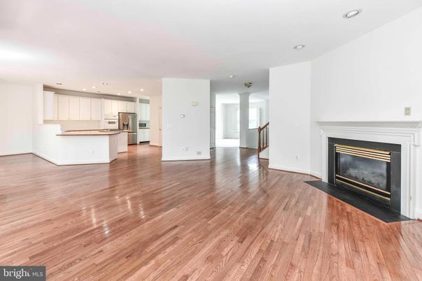 Empty room, Fireplace, Interior, Kitchen, Recessed Lighting, Wood Texture Flooring