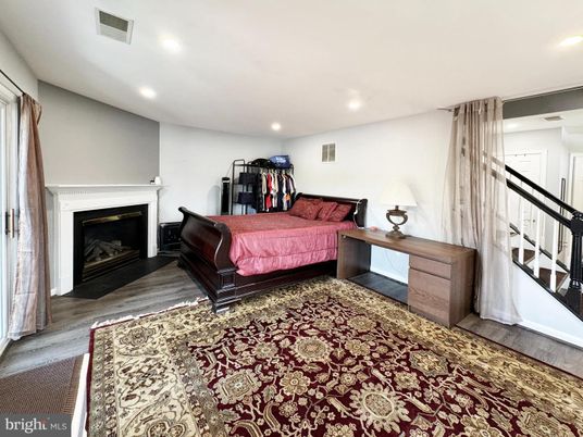 Bedroom, Fireplace, Interior, Recessed Lighting, Wood Texture Flooring