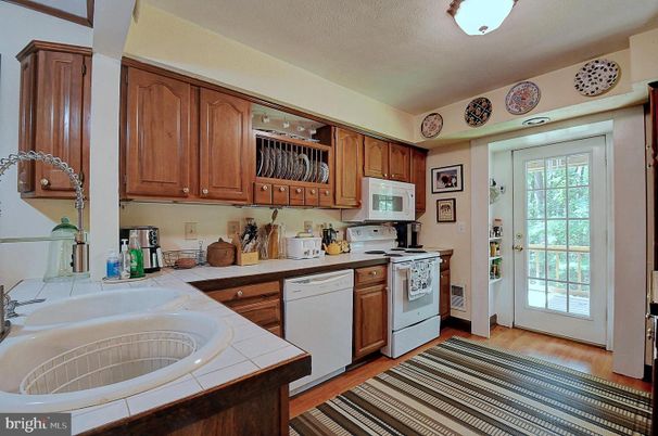 Interior, Kitchen, Tile Countertops, Wood Texture Flooring