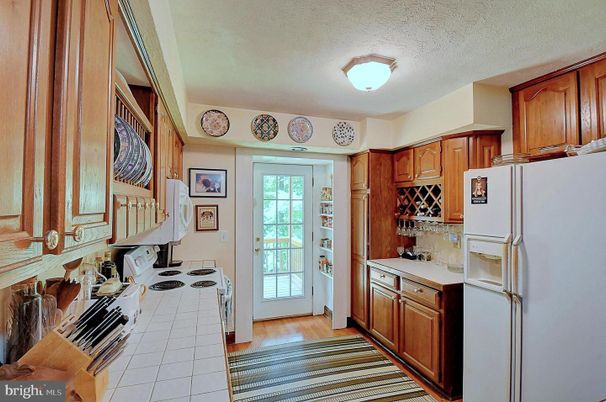 Interior, Kitchen, Tile Countertops, Wood Texture Flooring