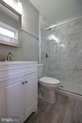 Bathroom, Glass Shower, Interior, Marble Walls, Wood Texture Flooring