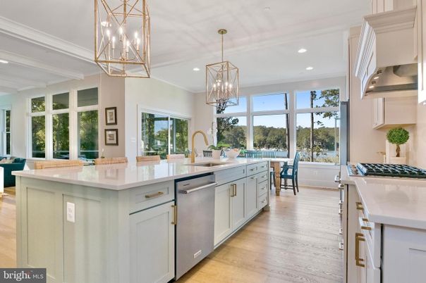Chandelier, Dining room, Interior, Kitchen, Pendant Lights, Recessed Lighting, Stainless Steel Appliances, Wood Texture Flooring