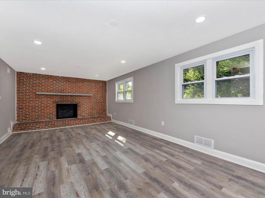 Empty room, Fireplace, Interior, Recessed Lighting, Stone Walls, Wood Texture Flooring