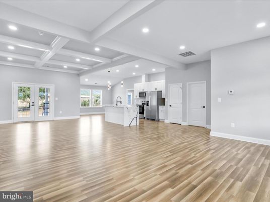 Empty room, Interior, Kitchen, Pendant Lights, Recessed Lighting, Stainless Steel Appliances, Wood Texture Flooring