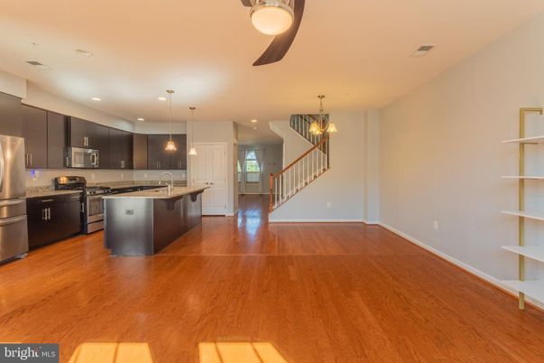 Chandelier, Interior, Kitchen, Pendant Lights, Recessed Lighting, Stainless Steel Appliances, Wood Texture Flooring