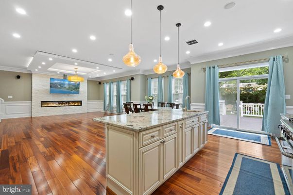 Dining room, Fireplace, Interior, Kitchen, Pendant Lights, Recessed Lighting, Wood Texture Flooring