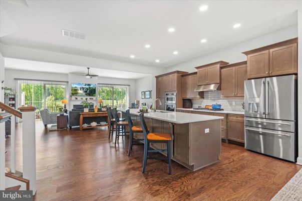 Dining room, Interior, Kitchen, Living room, Recessed Lighting, Stainless Steel Appliances, Wood Texture Flooring
