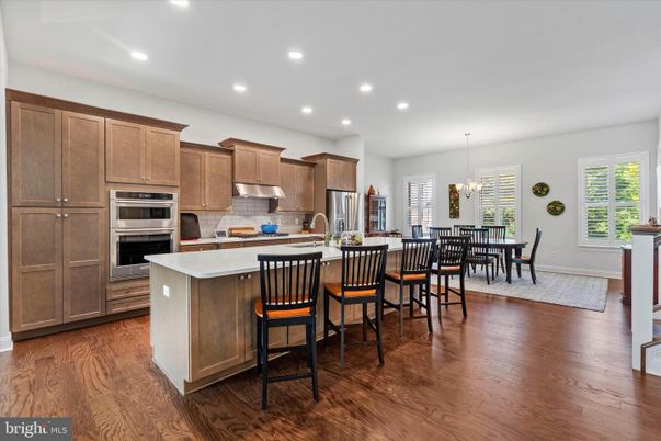 Chandelier, Dining room, Interior, Kitchen, Recessed Lighting, Stainless Steel Appliances, Wood Texture Flooring