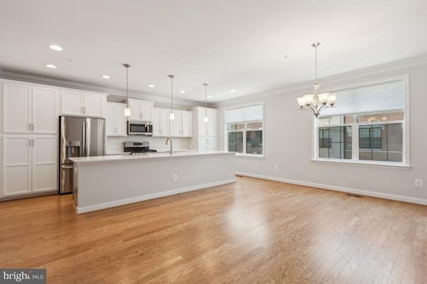 Chandelier, Interior, Kitchen, Pendant Lights, Recessed Lighting, Stainless Steel Appliances, Wood Texture Flooring