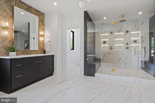 Bathroom, Dual Sink Vanities, Glass Shower, Interior, Marble, Marble Walls, Recessed Lighting