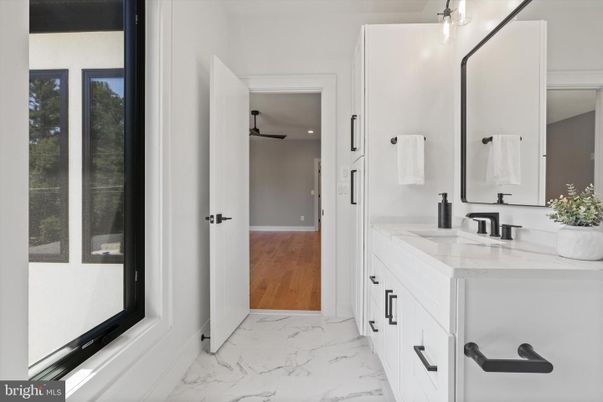Bathroom, Dual Sink Vanities, Interior, Marble, Recessed Lighting, Wood Texture Flooring