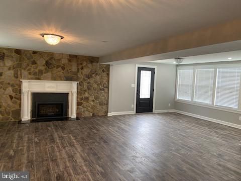 Empty room, Fireplace, Interior, Recessed Lighting, Stone Walls, Wood Texture Flooring
