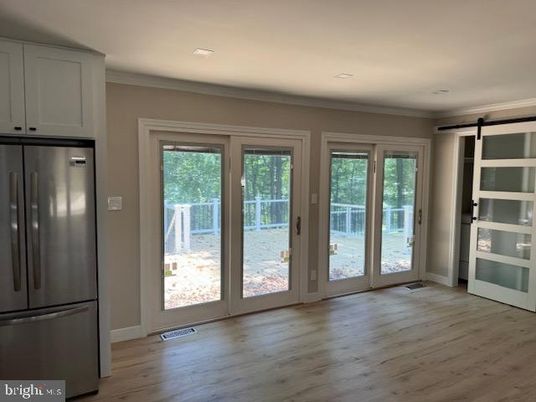 Empty room, Interior, Recessed Lighting, Stainless Steel Appliances, Wood Texture Flooring