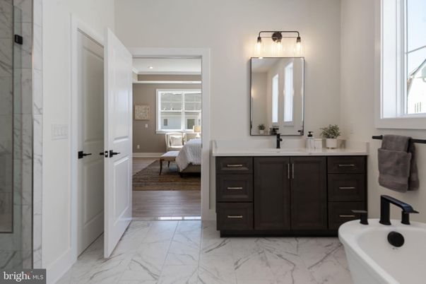 Bathroom, Bedroom, Dual Sink Vanities, Interior, Marble, Marble Walls, Recessed Lighting, Wood Texture Flooring