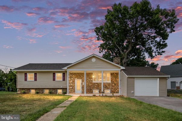 Attached, Backyard, Detached Garage, Exterior, Facade, Brick Facade, Split Level