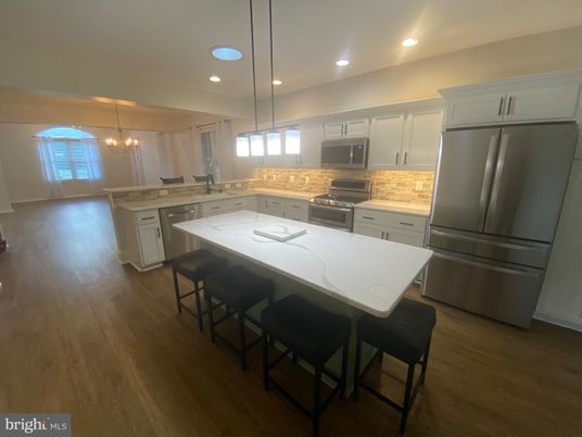 Chandelier, Interior, Kitchen, Pendant Lights, Recessed Lighting, Stainless Steel Appliances, Wood Texture Flooring