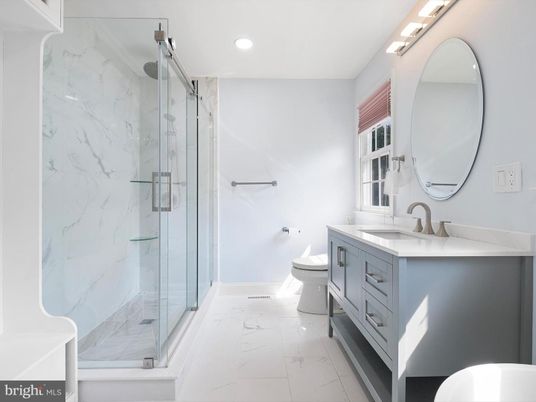Bathroom, Dual Sink Vanities, Glass Shower, Interior, Marble, Marble Walls, Recessed Lighting